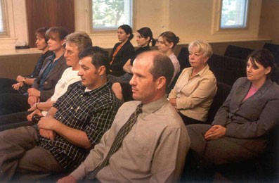 people sitting in courtroom